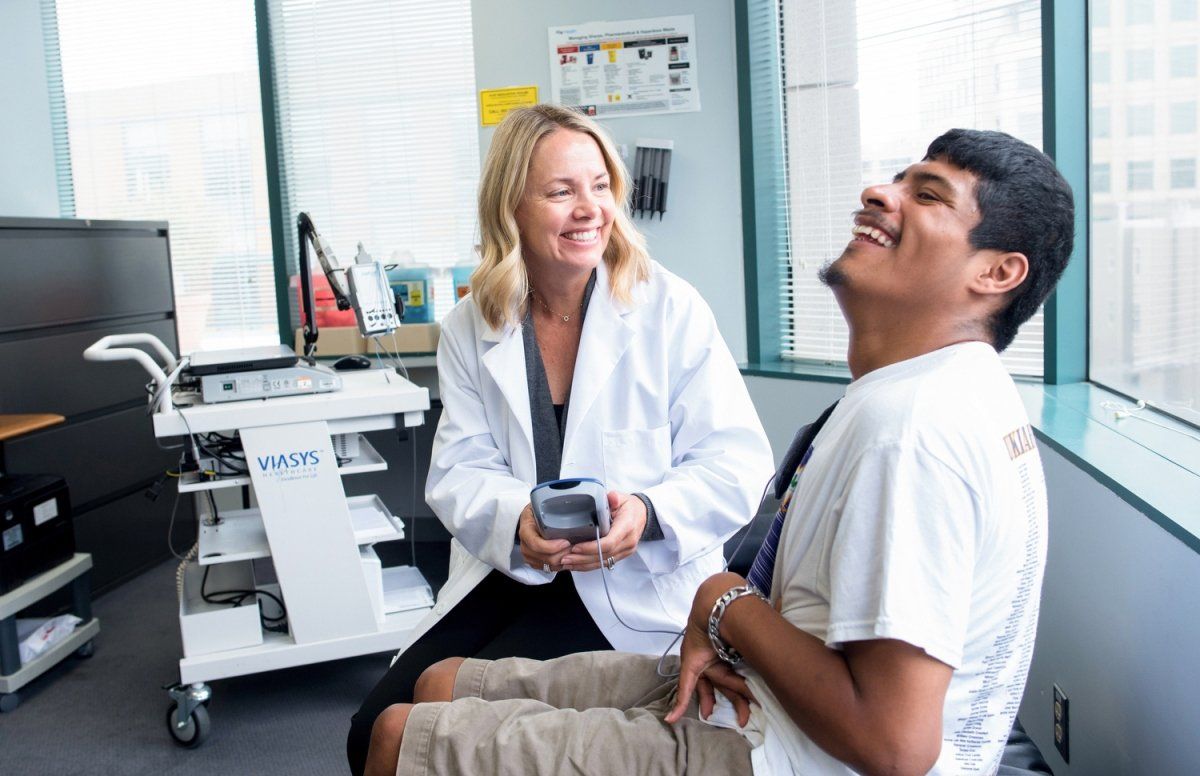 Jill L. Ostrem, MD, the Carlin & Ellen Wiegner Endowed Professor of Neurology examines a patient