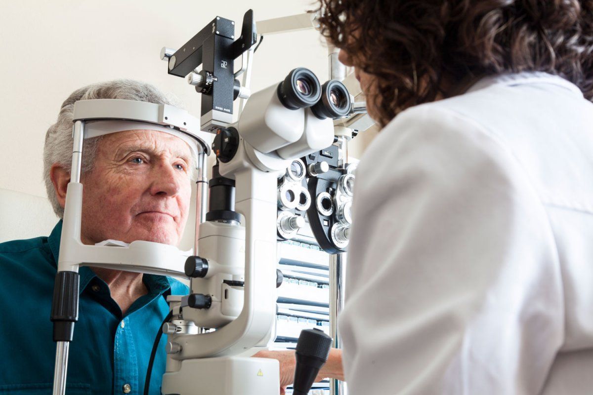 Elderly man getting an eye exam