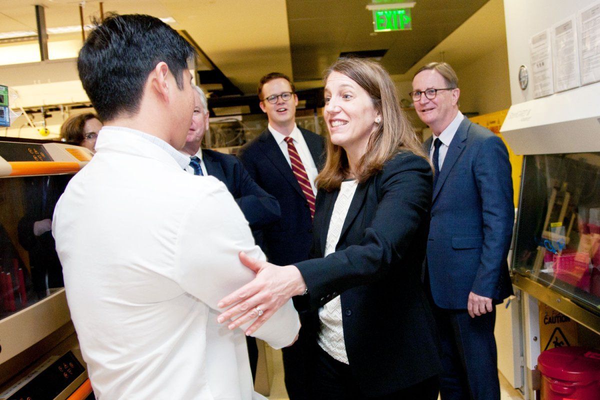 Secretary Burwell shakes hands with Eric Chow, director of the Center for Advanced Technology