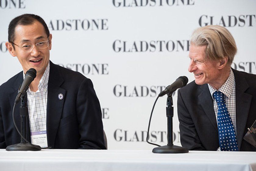 Shinya Yamanaka, MD, PhD and with John Gurdon, PhD in front of the microphone