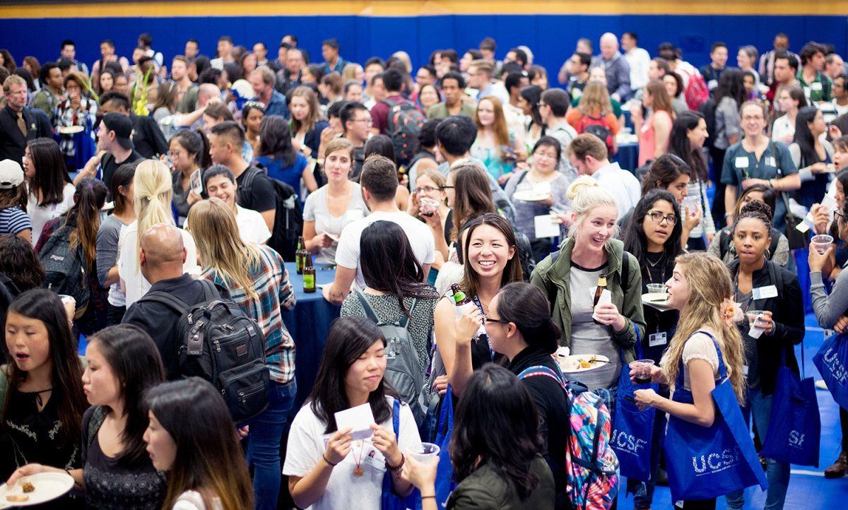 Students mingle in the Millberry Union Gym during the Chancellor's Reception