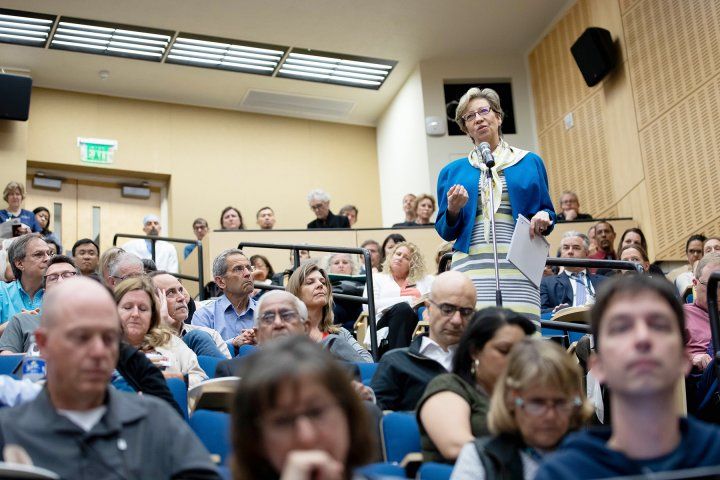 an audience member speaks during the Parnassus town hall