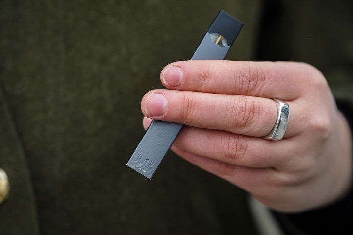 Hand holding JUUL