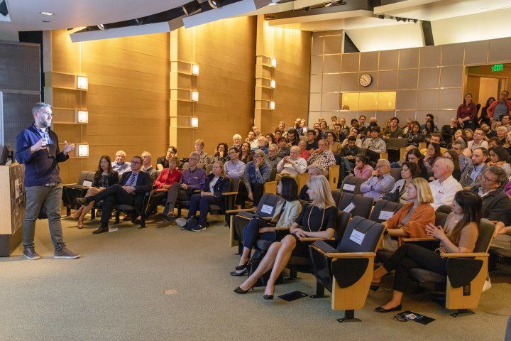crowd listens to lecture