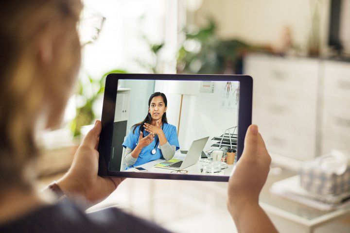 doctor does telemedicine call on iPad