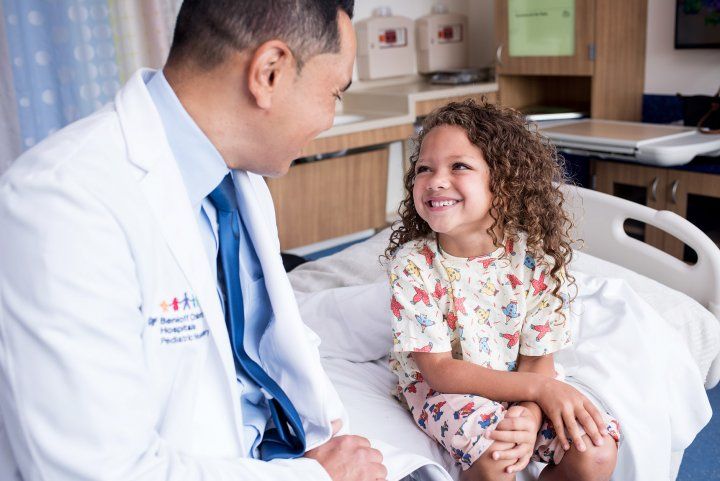 doctor talks with young patient