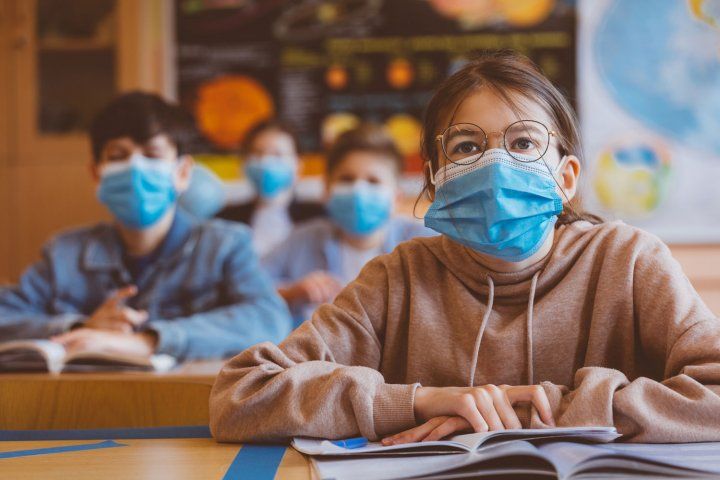 Kids in masks in a classroom