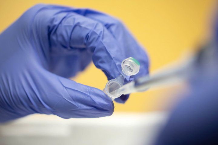 pipetting into a test tube in a UCSF lab