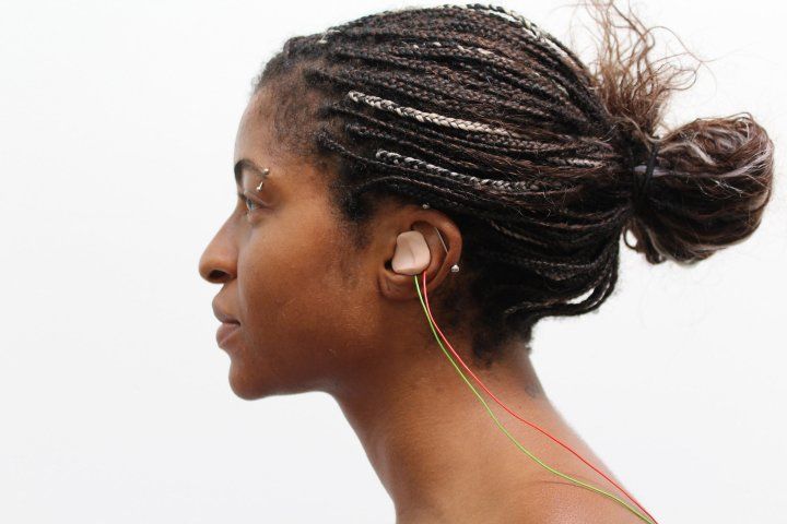 woman wears an earbud