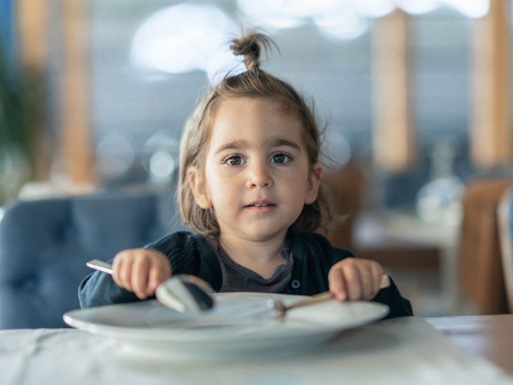 Young child with empty plate