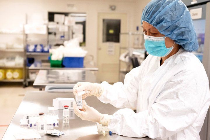 Pharmacy student prepares medicine in a pharmacy