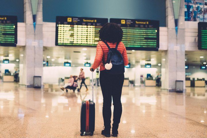 woman standing in an airport terminal