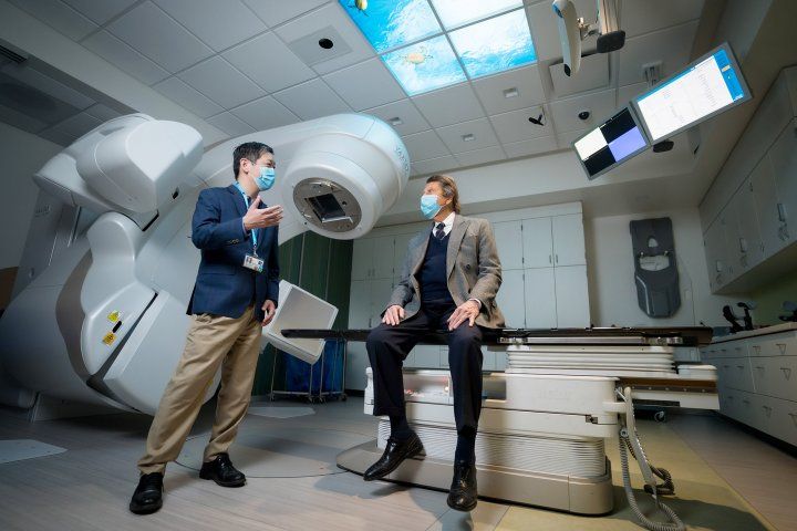 doctor and patient talk in an room with an imaging machine