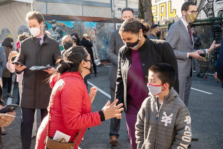 Woman and her son talk to the San Francisco Mayor London Breed