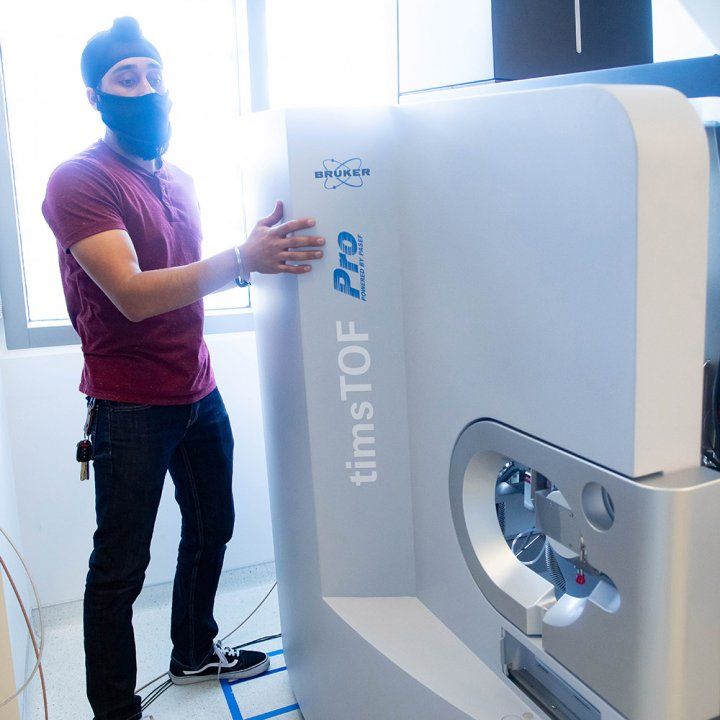 An engineer installing a highly sensitive high speed massive computer