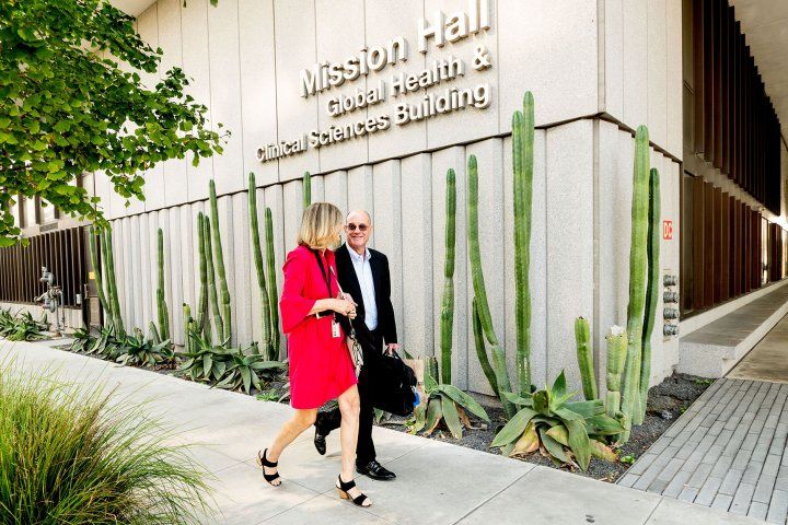 David Julius and Holly Ingraham walk onto the UCSF Mission Bay campus