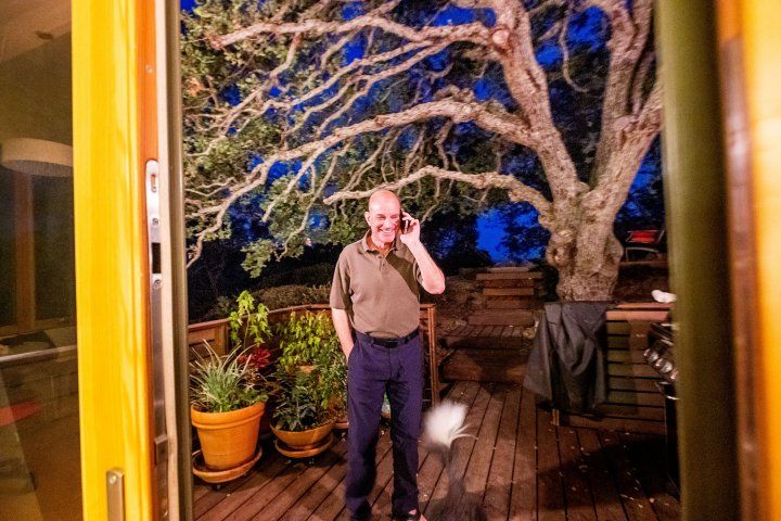 David Julius talks on his phone on the patio of his house in Walnut Creek