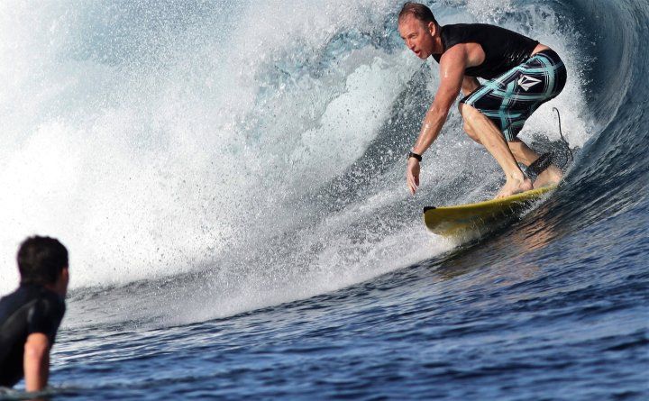Patient Chris Barr surfing befre his spinal injury