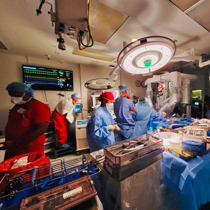 A team of surgeons in an operating room