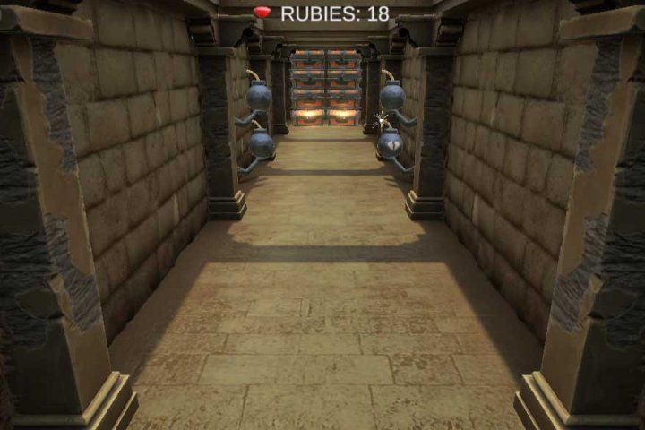 A screenshot of a video game showing a hallway with treasure chests at the end and bombs in front of them.