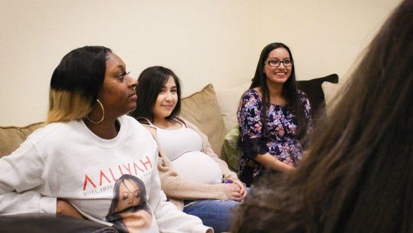 Three pregnant women sitting