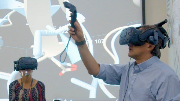 Two people using VR headsets