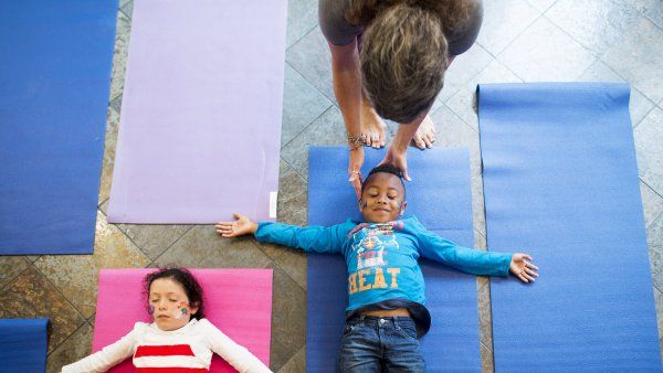 children doing yoga meditation breathing