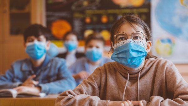 Kids in masks in a classroom