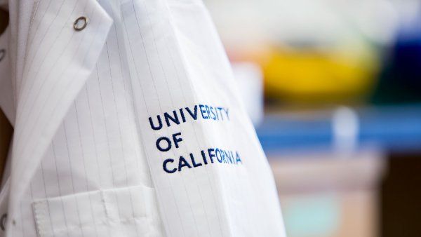 Lab coat with "University of California" on sleeve