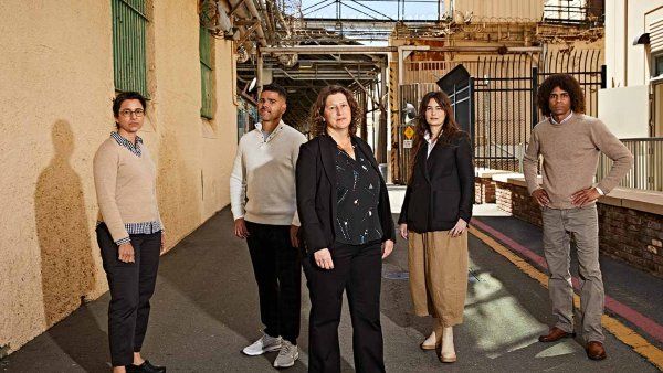Photo of Amend director Brie Williams, MD (center), with San Quentin State Prison medical chief Alison Pachynski, MD ’02 (left), and Amend team members Fernando Murillo, Michele Casadei, and Daryl Norcott, JD.