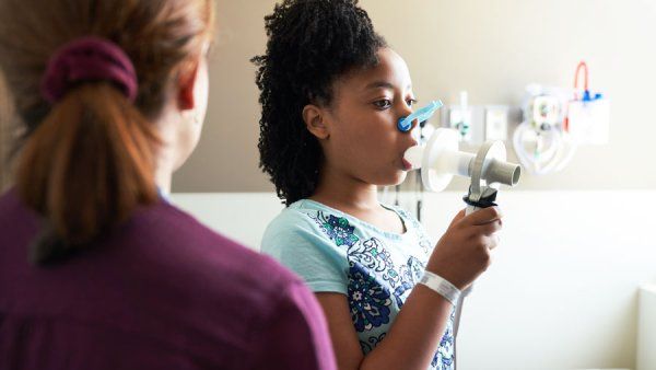 Young African-American girl receives care for asthma