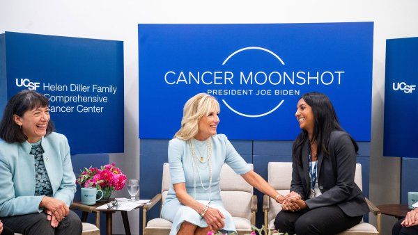 First Lady, Dr. Jill Biden (center) speaks with cancer researchers. Left to right: Monica Bertagnolli, MD, First Lady Jill Biden, PhD, Kami Pullakhandam.