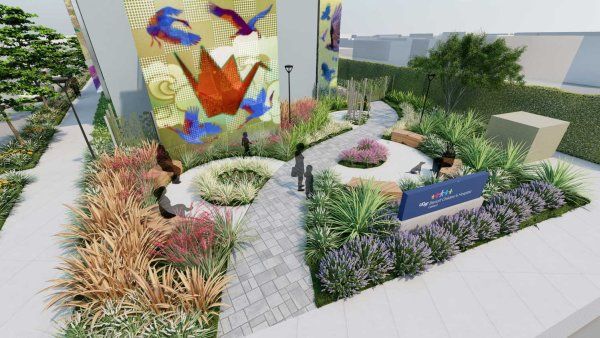 A computer rendering of a garden in front of a clinic. A UCSF Benioff Children's Hospital sign is on a garden bed, and a mural of birds and and origami swan is on the clinc's wall.