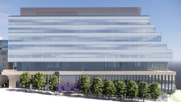 A rendering of a tiered glass building with a line of trees running along its side.