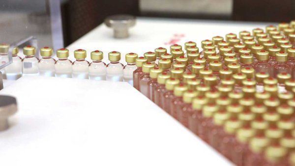 Vials of insulin in a production line.