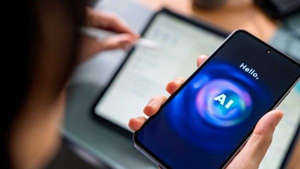 A man uses AI on his cell phone.