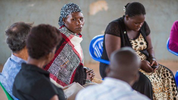 A group of women at a district hospital in Uganda discuss HIV care.