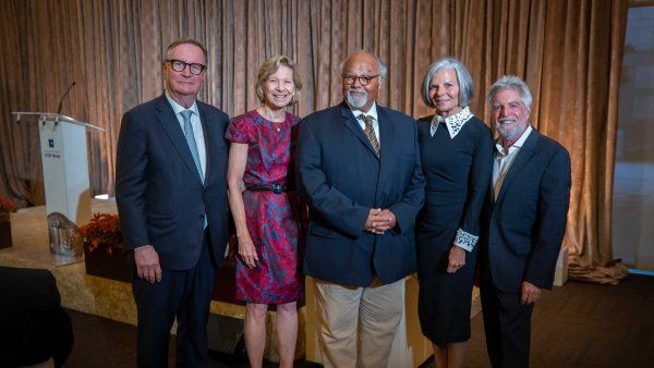 A group photo of U C S F Chancellor Sam Hawgood and the four recipients of the 2026 U C S F Medal.