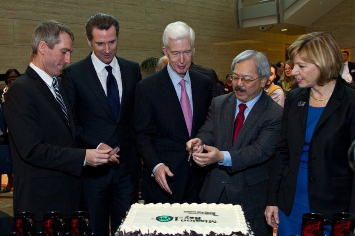 Government Official cutting a cake
