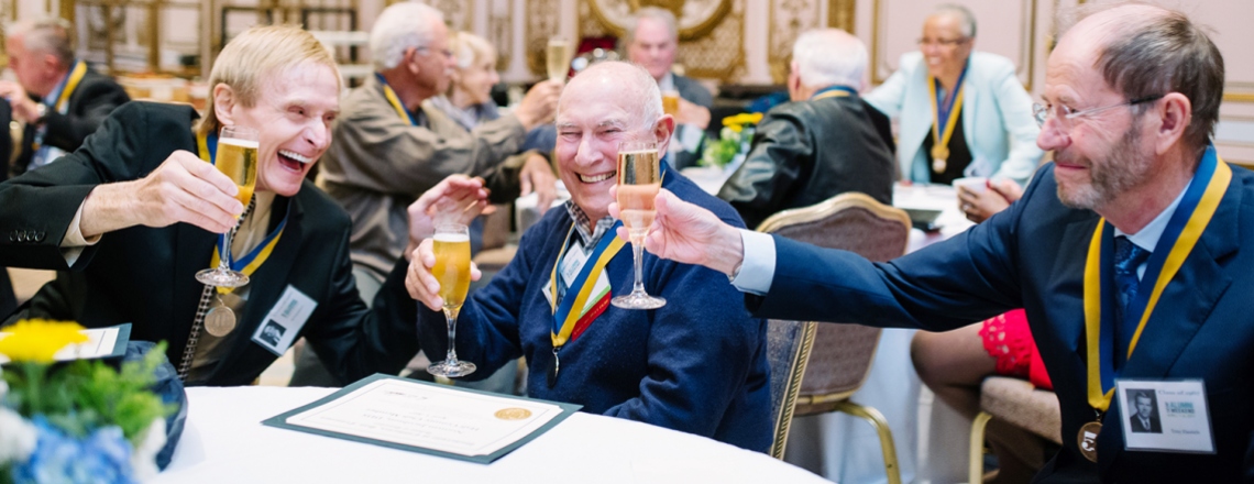 UCSF alumni cheers one another during a 50th anniversary gathering