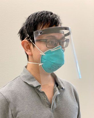 Man wearing 3D printed face shield