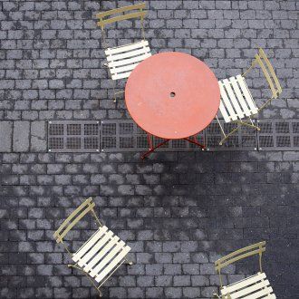 Tables and chairs line an outdoor patio at The Pub