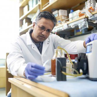 Shuvo Roy with the prototype for an artificial kidney