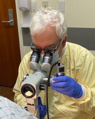 Joel Palefsky uses a colposcope as part of a high-resolution anoscopy procedure.