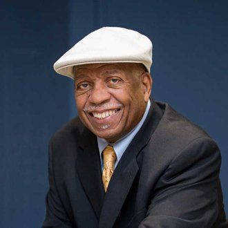 Headshot of John Watson.