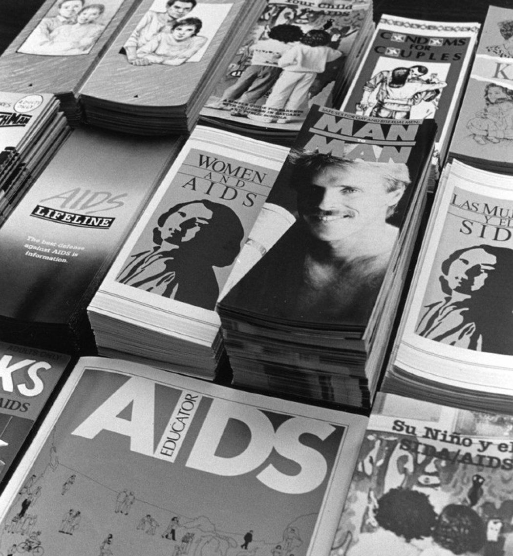 Stacks of pamphlets on AIDS during the height of the AIDS epidemic in black and white