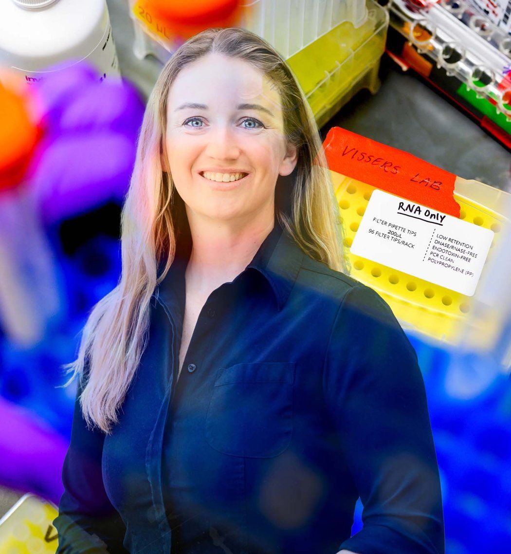 Caroline Vissers smiles against an abstract research background