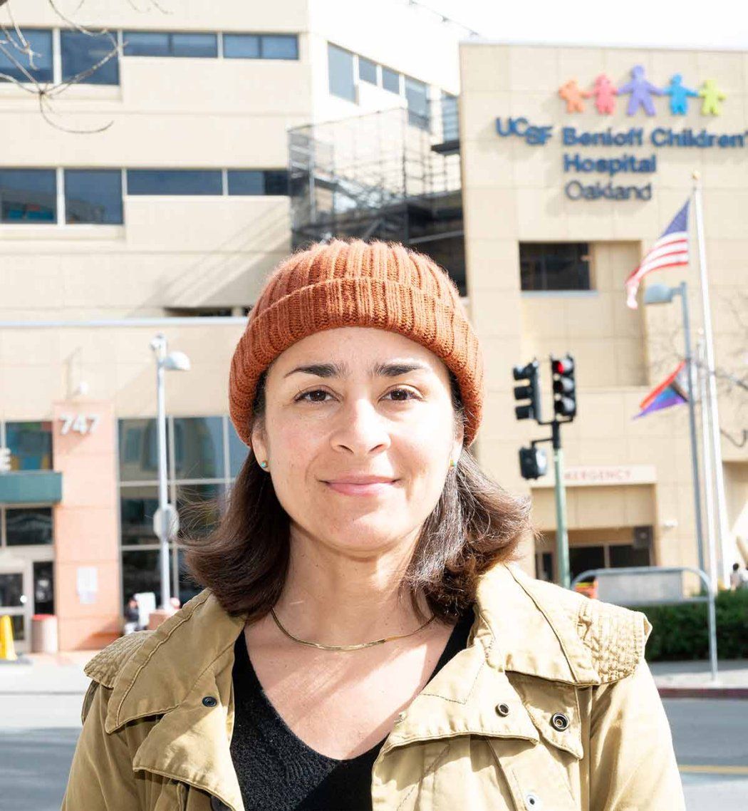 Artist Adia Millett stands in front of the entrance to Benioff Children's Hospital, Oakland.