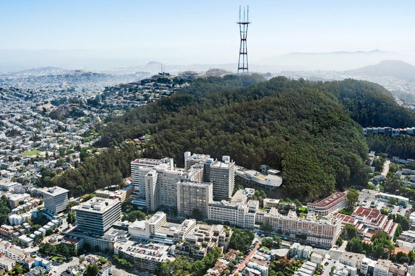 A distant aerial shot of the Parnassus Heights campus and Mount Sutro