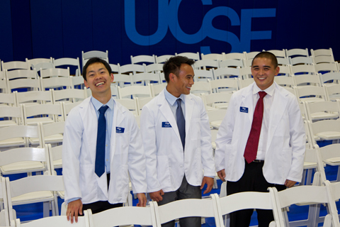 First-year medical students, from left, Kent Feng, Tuyen Kiet and Matthew Dizon, pose for a picture after the White Coat Ceremony at UCSF.